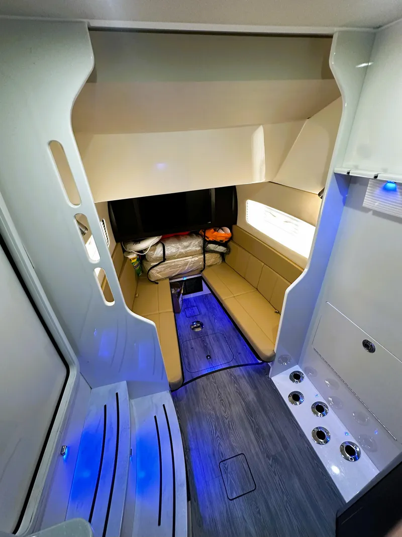Slide: The Image of Interior of 2020 Scout 380 LXF boat with modern seating and ambient lighting. - 19