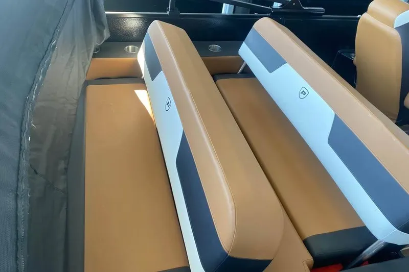 Slide: The Image of 2025 Premier Solaris 230RL interior seating with tan and gray upholstery. - 6
