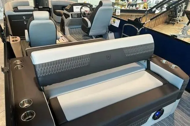 Slide: The Image of 2025 Premier Solaris 230RL boat interior with luxurious seating and modern dashboard. - 8