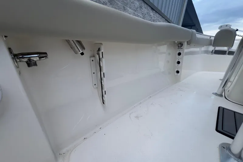 Slide: The Image of 2024 Key West 203 FS boat interior, featuring clean white deck and fittings. - 10