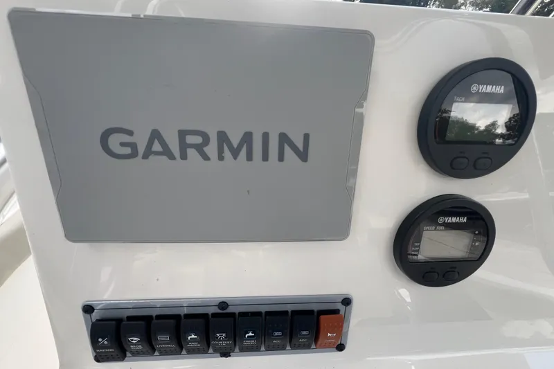 Slide: The Image of 2024 Key West 203 FS dashboard with Garmin and Yamaha displays. - 11