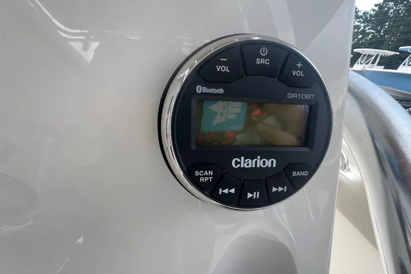 Slide: The Image of Clarion audio system on 2024 Key West 203 FS boat dashboard. - 12