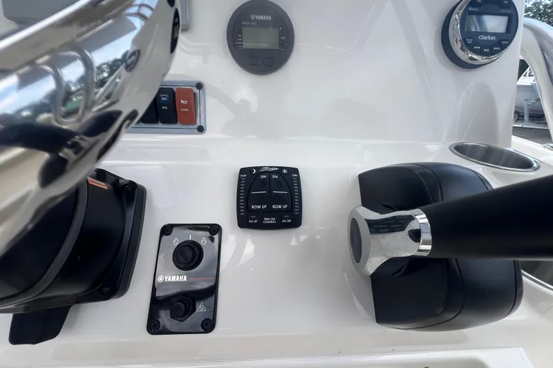 Slide: The Image of 2024 Key West 203 FS boat dashboard with Yamaha controls and Clarion audio system. - 13
