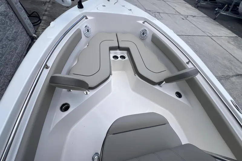Slide: The Image of 2024 Key West 203 FS boat interior with cushioned seating and stainless steel accents. - 15