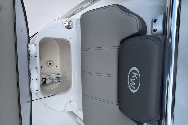Slide: The Image of 2024 Key West 203 FS boat seat and storage compartment detail. - 16