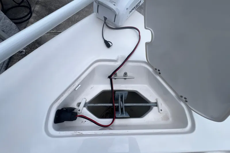 Slide: The Image of 2024 Key West 203 FS boat anchor compartment with wiring and storage space. - 19