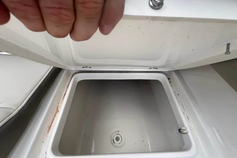 Slide: The Image of Open storage compartment on 2024 Key West 203 FS boat, showing interior details. - 23