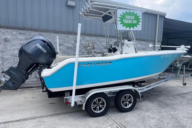 Slide: The Image of 2024 Key West 203 FS boat on trailer, fresh trade-in, with Yamaha outboard motor. - 3