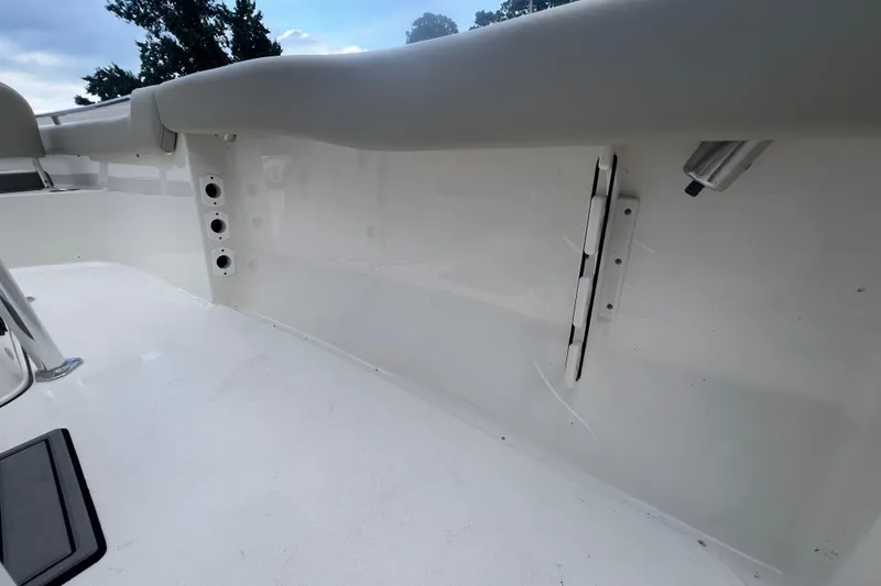 Slide: The Image of 2024 Key West 203 FS boat interior with white seating and fixtures. - 9
