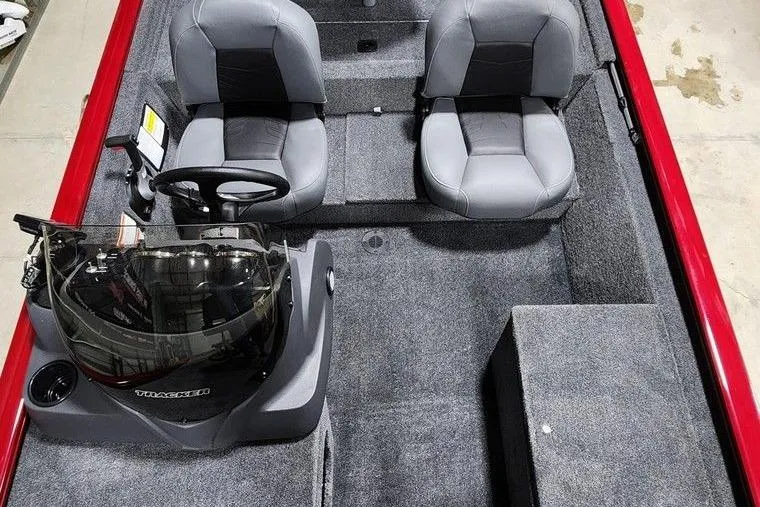 Slide: The Image of 2026 Tracker Pro 170 boat interior with dual seats and steering console. - 10