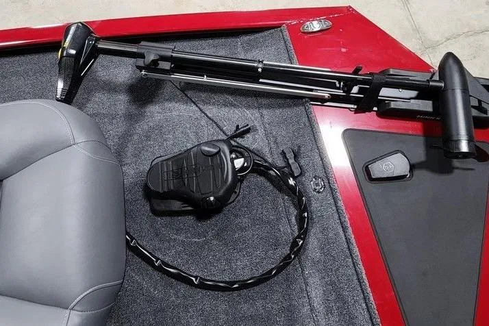 Slide: The Image of 2026 Tracker Pro 170 boat interior with trolling motor and foot pedal on red carpet. - 5