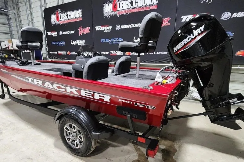 Slide: The Image of 2026 Tracker Pro 170 boat with Mercury engine in showroom display. - 8