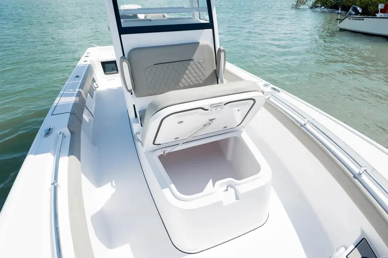 Slide: The Image of Manufacturer Provided Image: 2025 Sportsman Masters 247OE Bay Boat with open storage compartment on deck. - 7