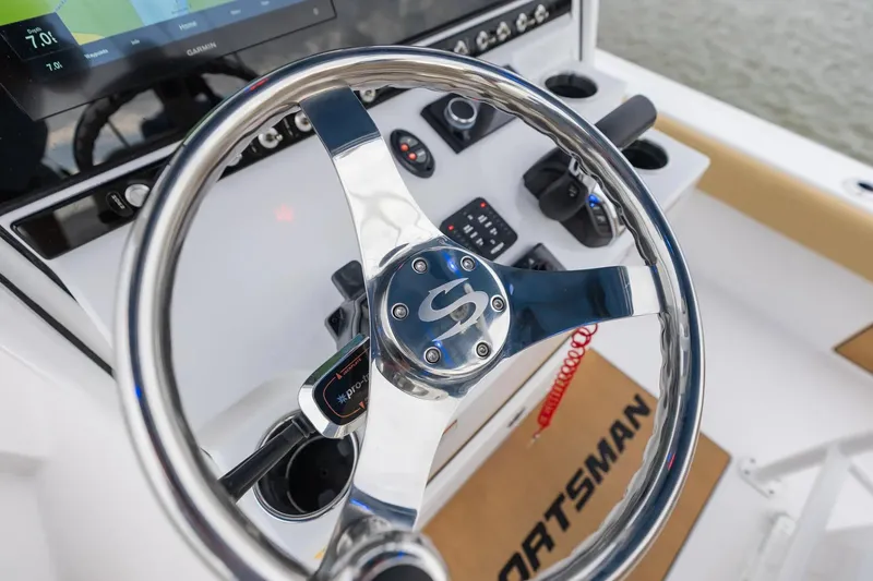 Slide: The Image of Manufacturer Provided Image: 2025 Sportsman Masters 247OE Bay Boat steering wheel and dashboard controls. - 9