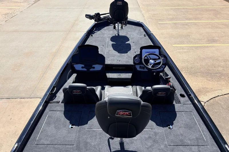 Slide: The Image of 2026 Ranger RT198P fishing boat interior with steering console and seating. - 11