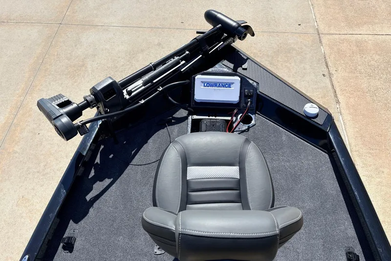 Slide: The Image of 2026 Ranger RT198P boat interior with Lowrance electronics and comfortable seating. - 13