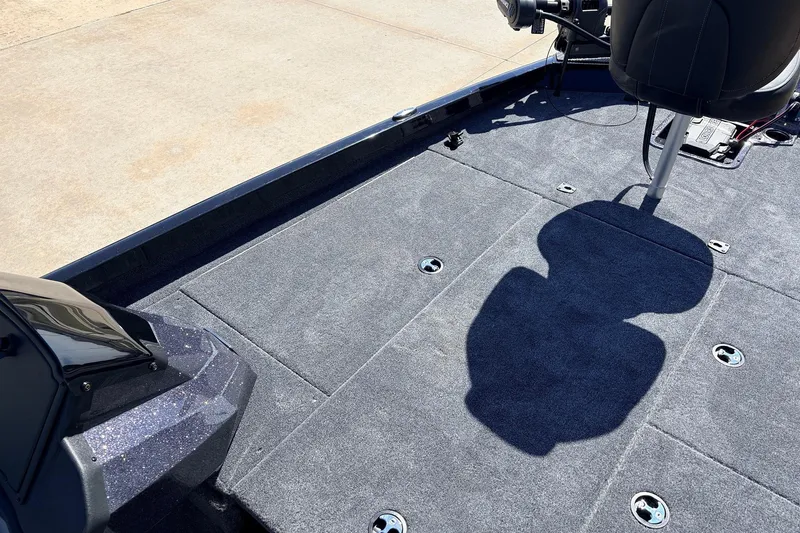 Slide: The Image of 2026 Ranger RT198P boat deck with carpeted flooring and seating area. - 16