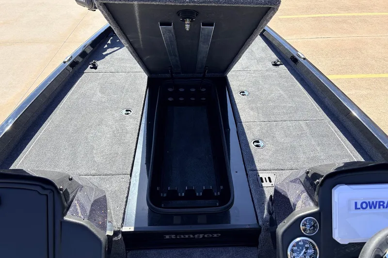 Slide: The Image of 2026 Ranger RT198P boat interior with open storage compartment and dashboard view. - 20
