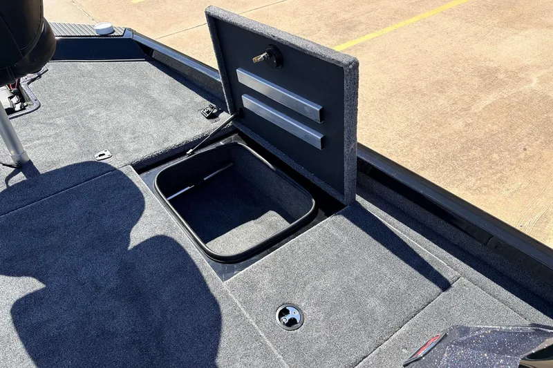 Slide: The Image of 2026 Ranger RT198P boat storage compartment open on deck. - 22