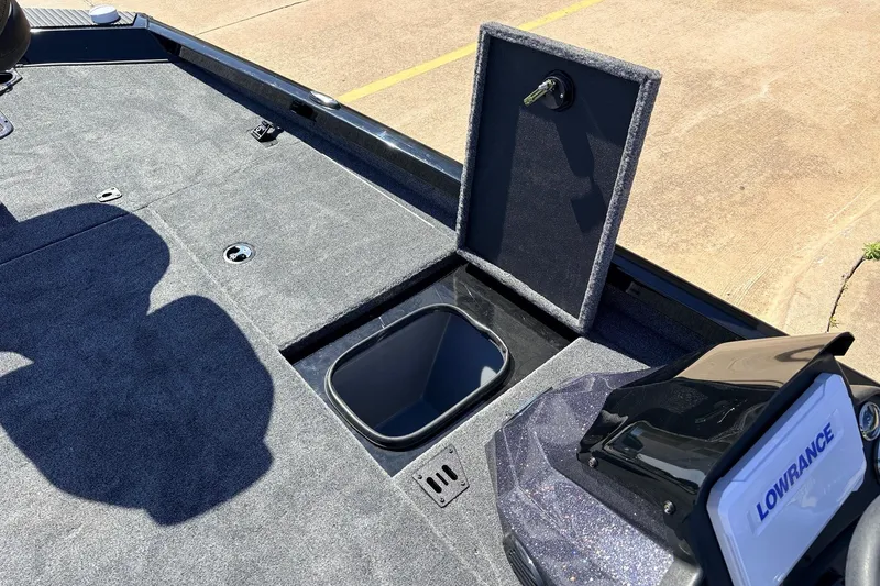 Slide: The Image of 2026 Ranger RT198P boat deck with storage compartment and Lowrance fish finder. - 24