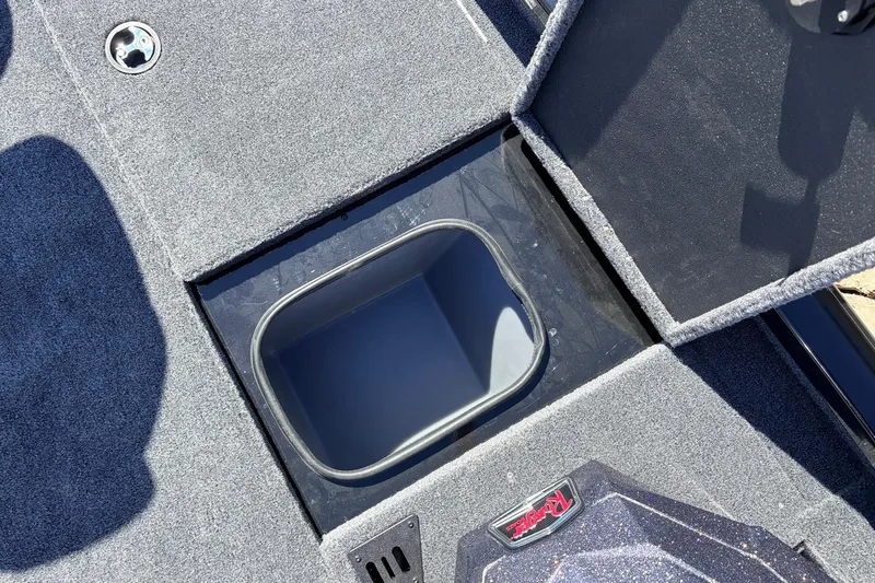 Slide: The Image of 2026 Ranger RT198P boat storage compartment with open lid, showcasing interior space. - 25