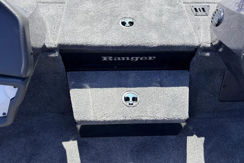 Slide: The Image of 2026 Ranger RT198P boat interior with carpeted steps and storage compartments. - 27