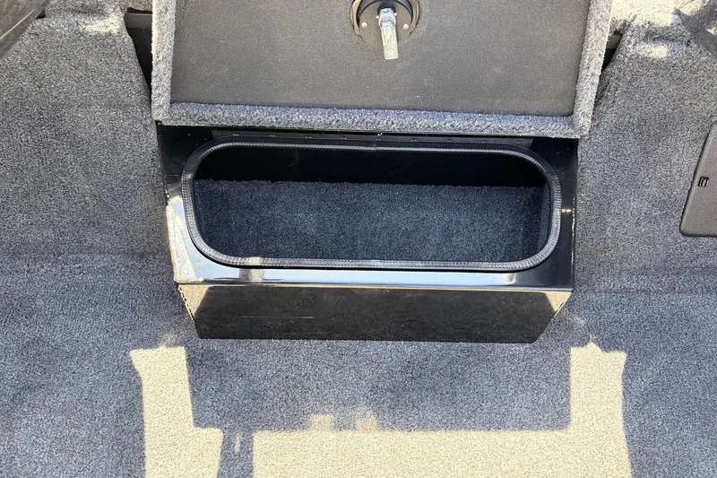 Slide: The Image of 2026 Ranger RT198P storage compartment with carpeted interior and secure lock. - 28