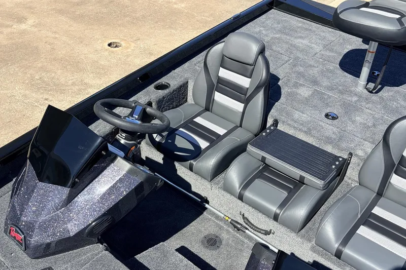 Slide: The Image of 2026 Ranger RT198P boat interior with sleek gray seating and modern steering console. - 30