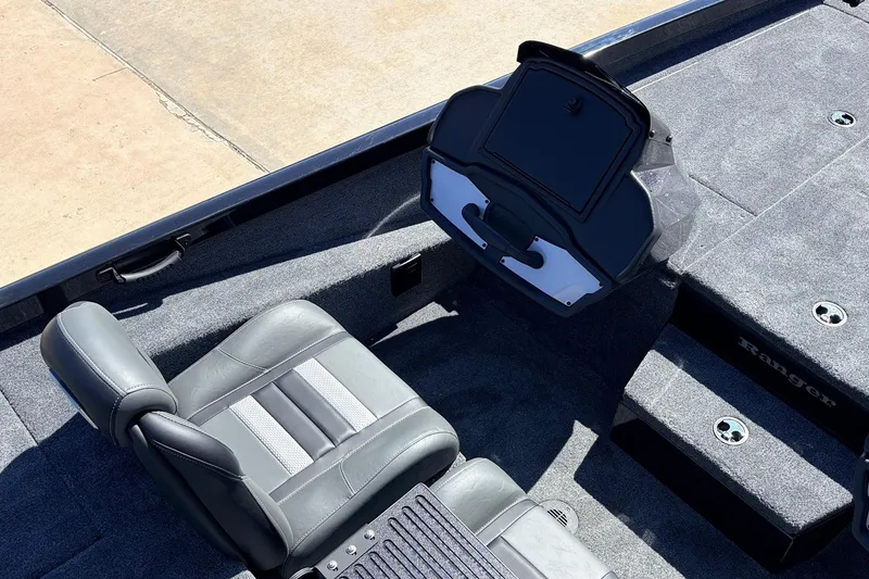 Slide: The Image of 2026 Ranger RT198P boat interior with gray seating and carpeted flooring. - 32