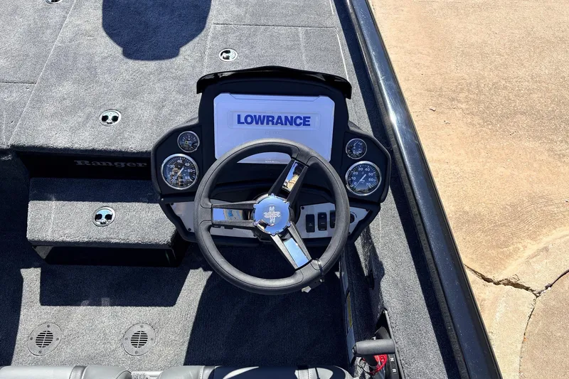 Slide: The Image of 2026 Ranger RT198P boat dashboard with Lowrance electronics and steering wheel. - 35