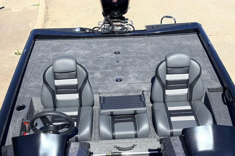 Slide: The Image of 2026 Ranger RT198P boat interior with dual gray seats and steering wheel. - 39