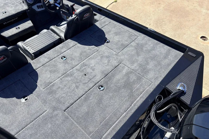 Slide: The Image of 2026 Ranger RT198P boat interior with gray carpet and seating. - 41