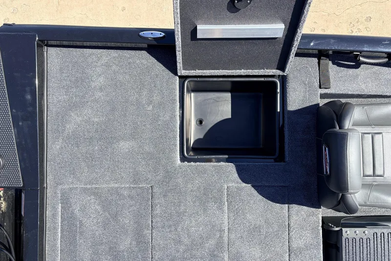 Slide: The Image of 2026 Ranger RT198P boat interior with open storage compartment and seating. - 43