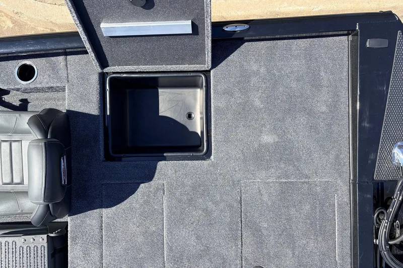 Slide: The Image of 2026 Ranger RT198P boat interior with open storage compartment and seating. - 45