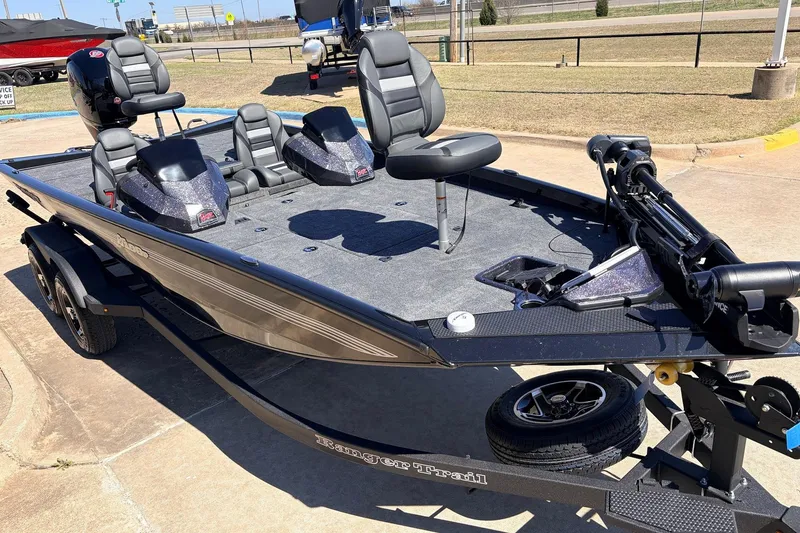 Slide: The Image of 2026 Ranger RT198P fishing boat with seating and trolling motor on a trailer. - 5