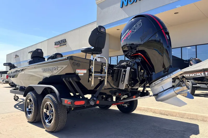 Slide: The Image of 2026 Ranger RT198P boat with powerful Mercury engine, displayed at a dealership. - 9