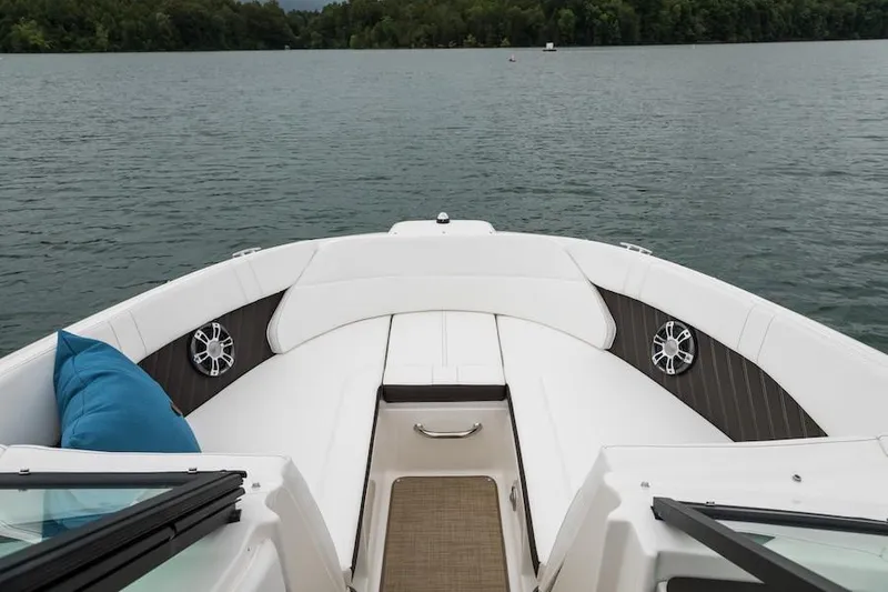 Slide: The Image of Manufacturer Provided Image: 2021 Sea Ray SPX 230 boat bow with seating on a lake. - 3