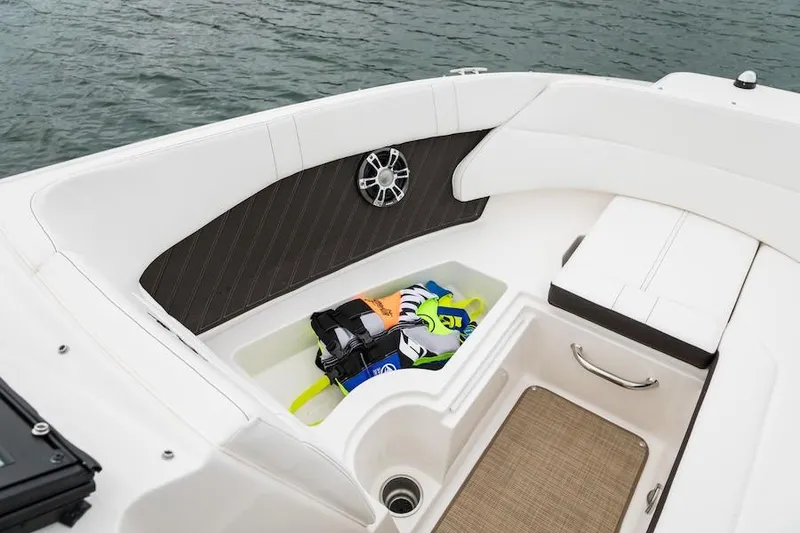 Slide: The Image of Manufacturer Provided Image: 2021 Sea Ray SPX 230 boat interior storage compartment with life jackets. - 4