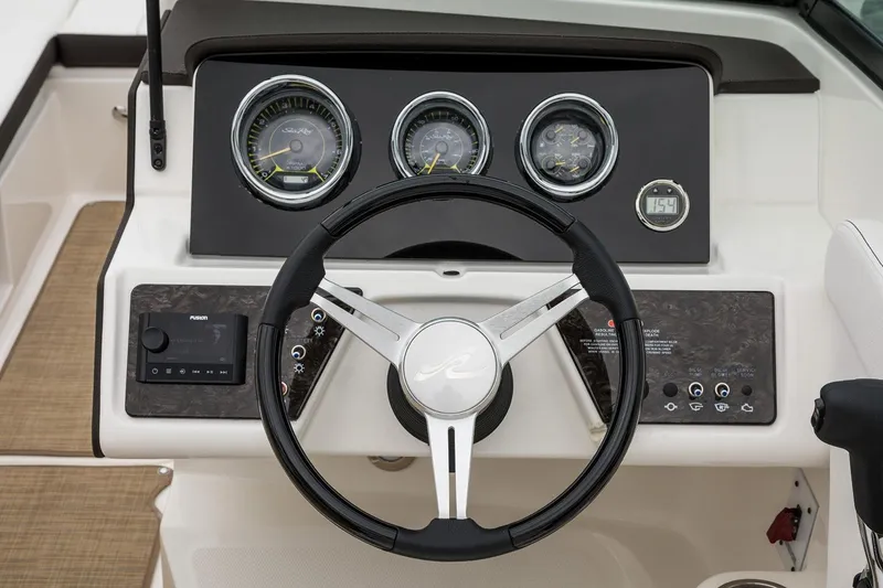 Slide: The Image of Manufacturer Provided Image: 2021 Sea Ray SPX 230 dashboard with steering wheel and gauges. - 7