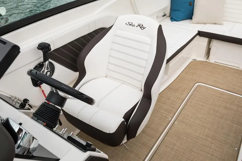 Slide: The Image of Manufacturer Provided Image: 2021 Sea Ray SPX 230 boat interior with captain's chair and steering wheel. - 8