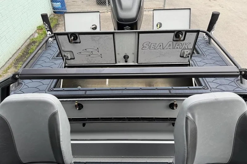 Slide: The Image of 2026 SeaArk Dynasty 2.0 boat interior with storage compartments and seating. - 18