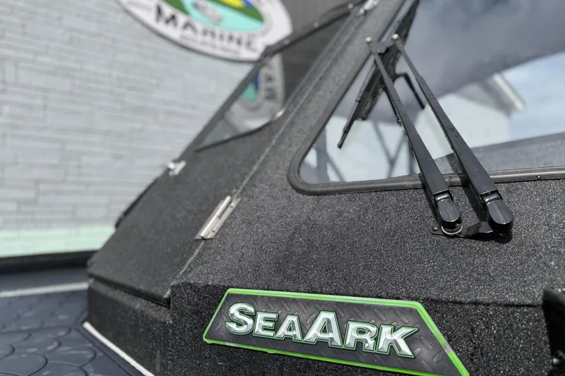 Slide: The Image of 2026 SeaArk Dynasty 2.0 boat with windshield wipers and logo detail. - 6