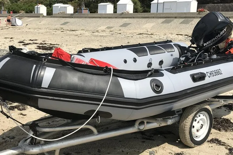 Slide: The Image of Inflatable Zodiac F43-C boat on trailer, beach setting, 2026 model. - 3