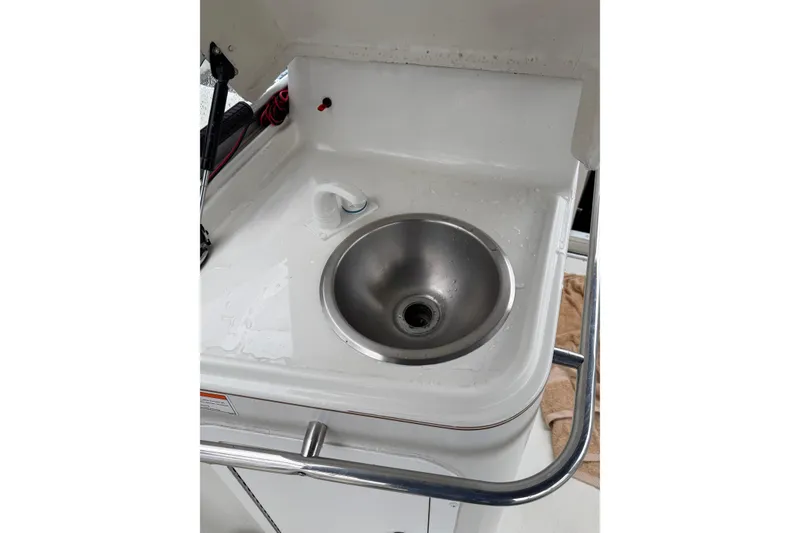 Slide: The Image of Stainless steel sink on 1997 Larson Cabrio 310 Mid-Cabin boat. - 11