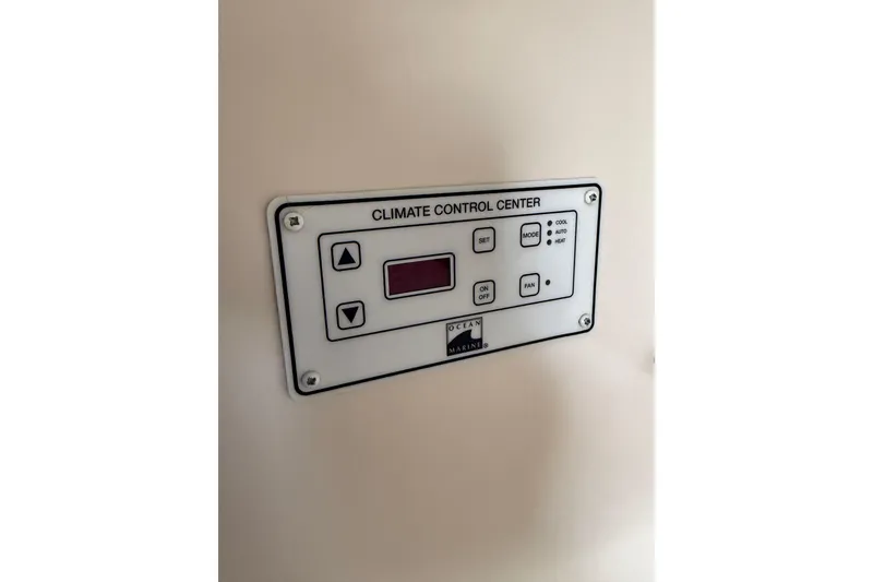 Slide: The Image of Climate control panel on 1997 Larson Cabrio 310 Mid-Cabin boat. - 22