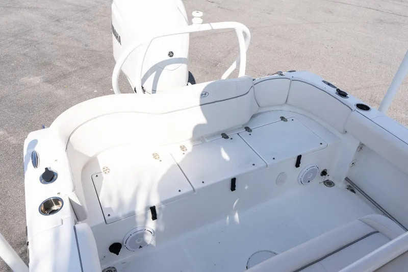 Slide: The Image of 2023 Sea Hunt Ultra 239 SE boat interior with seating and storage compartments. - 10