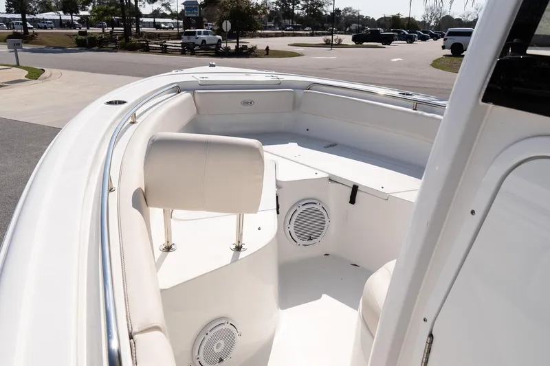 Slide: The Image of 2023 Sea Hunt Ultra 239 SE boat interior with seating and speaker system. - 18