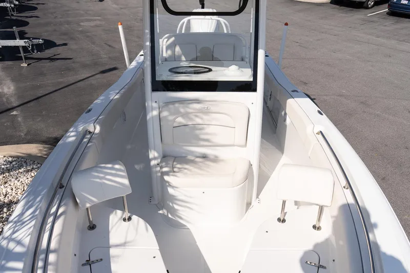 Slide: The Image of 2023 Sea Hunt Ultra 239 SE boat interior with seating and console. - 21