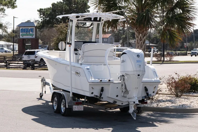 Slide: The Image of 2023 Sea Hunt Ultra 239 SE boat on trailer near Neuse Sport Shop. - 4