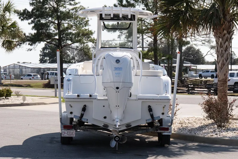 Slide: The Image of 2023 Sea Hunt Ultra 239 SE boat on trailer, rear view, parked outdoors. - 5